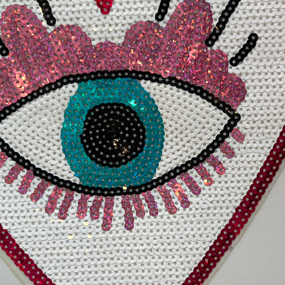 The eye that sees all sequence applique.